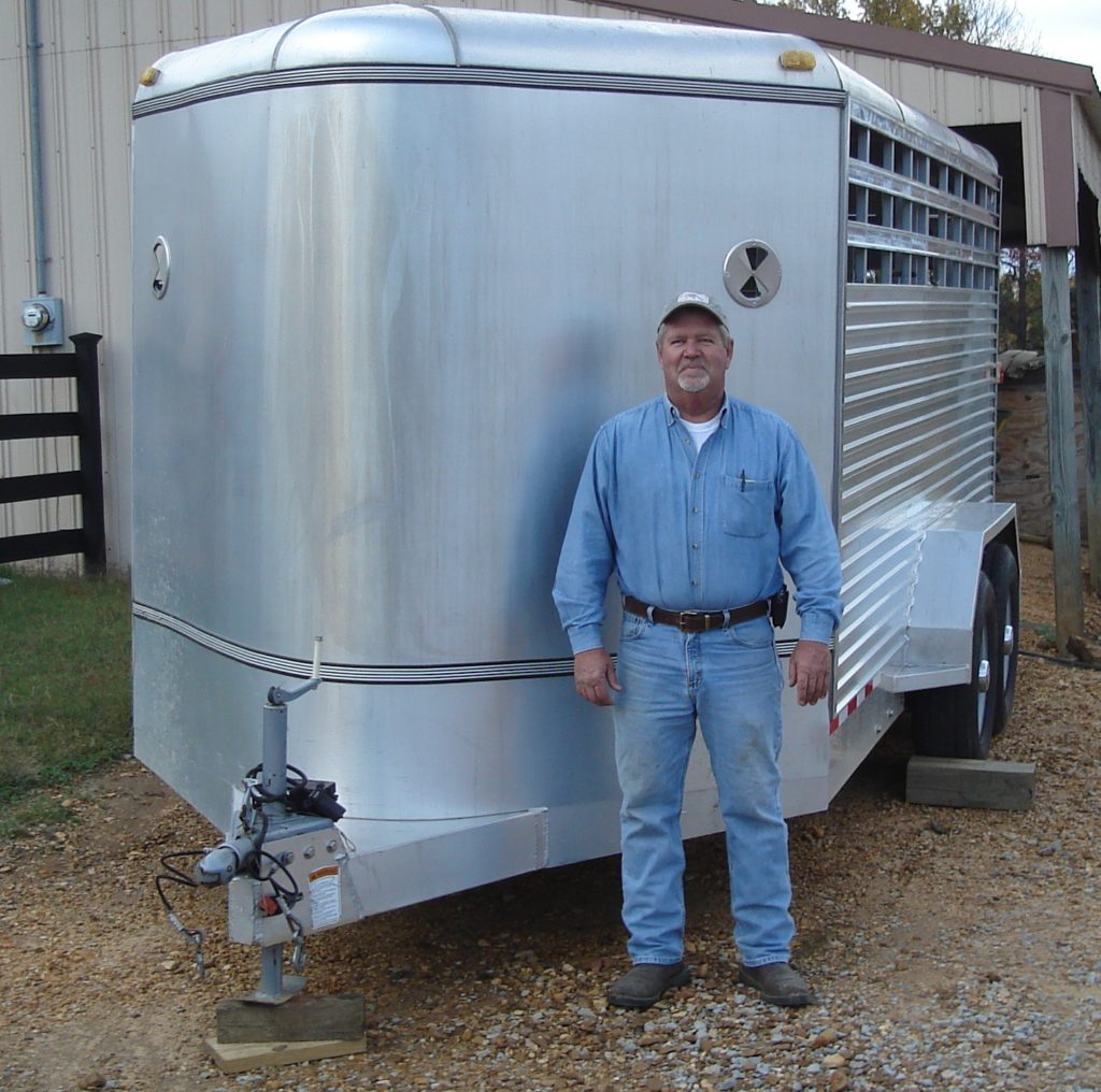 Gaylon Smith, Lauderdale County Livestock member using stock trailer.